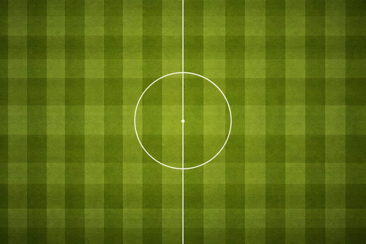 Vista cenital de un campo de fútbol con líneas de juego marcadas sobre césped verde intenso